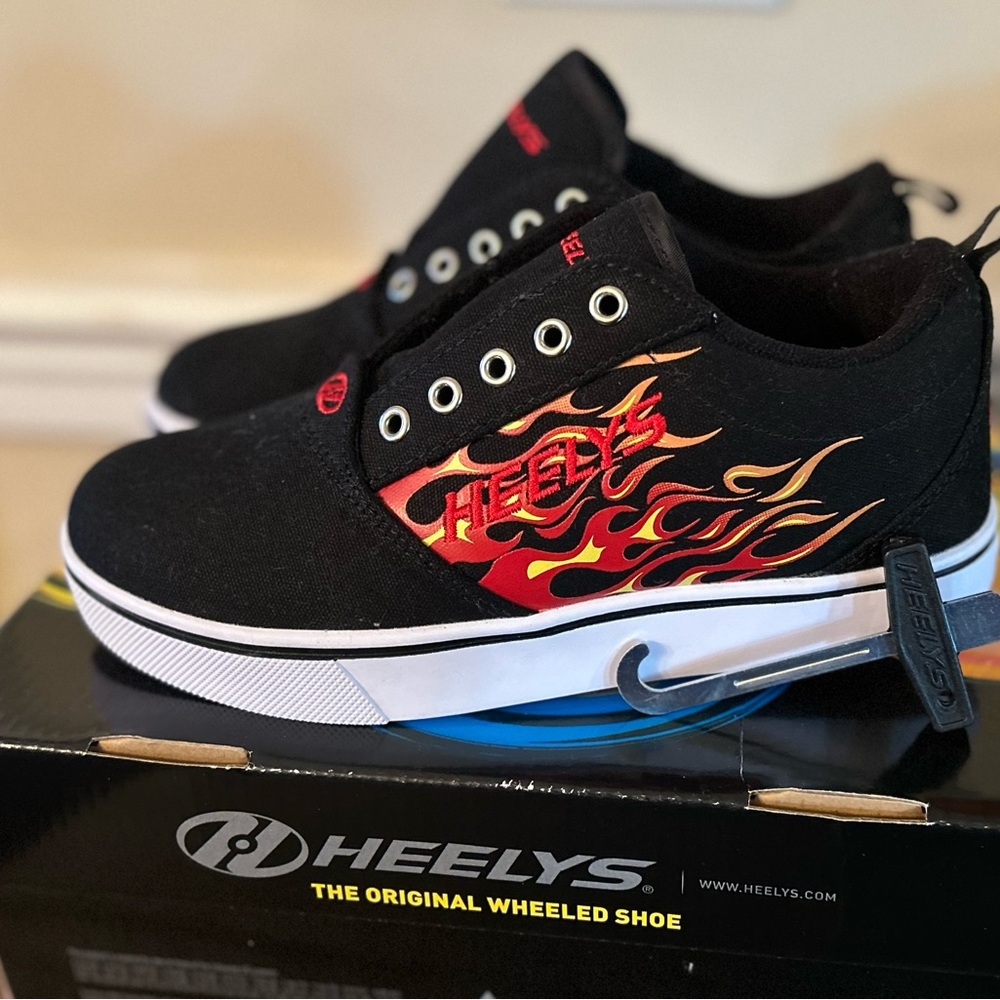 Boys Heelys Seakers. Never worn but do need new laces.